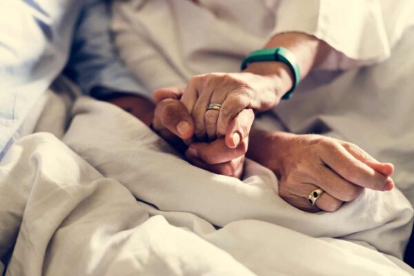 13176-holding-hands-together-for-comfort-and-support-2026-01-07-23-25-05-utc