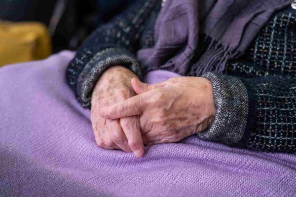 13177-close-up-of-wrinkled-hands-on-soft-fabric-2026-01-11-10-11-55-utc